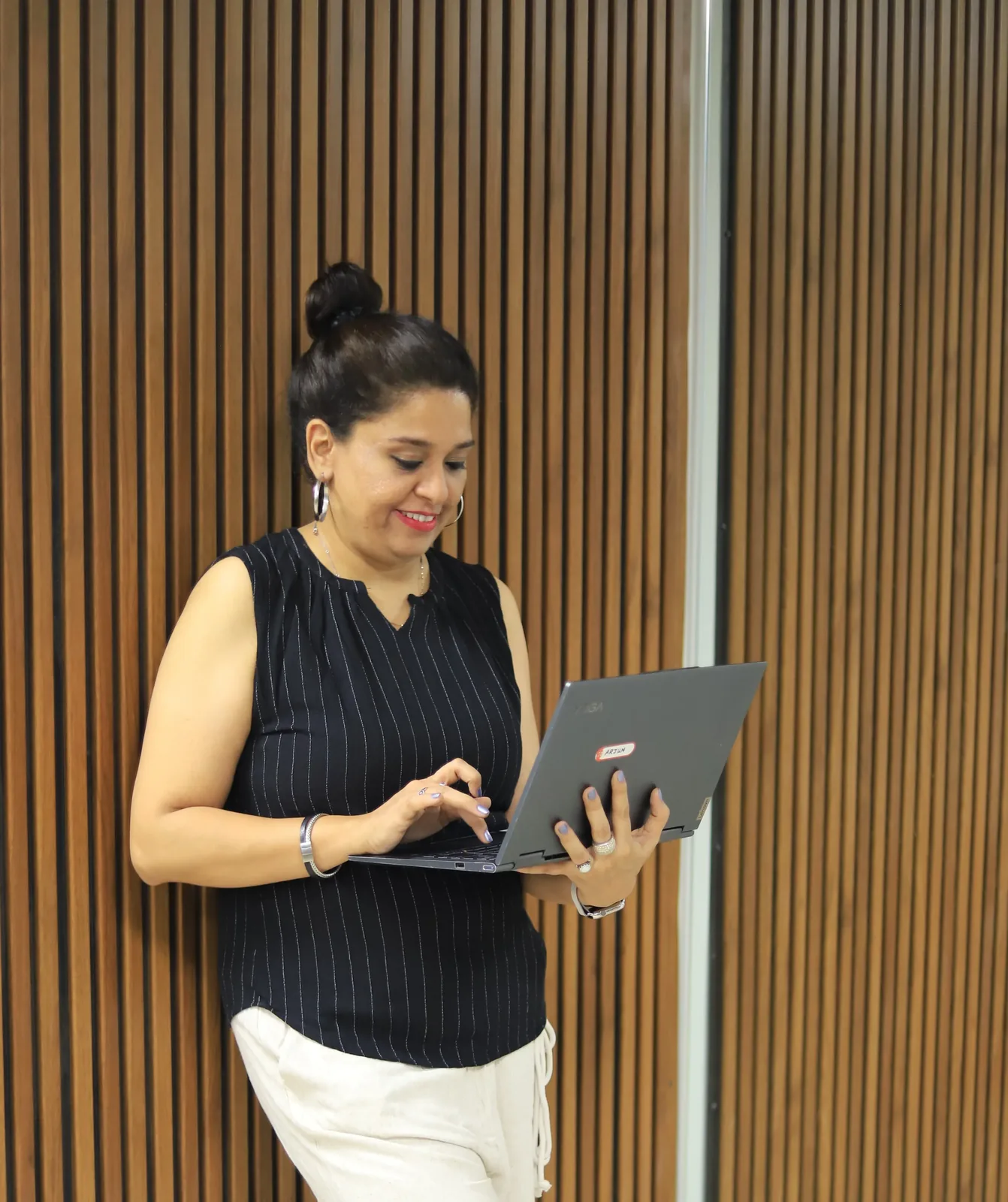Meera Grover working on a laptop