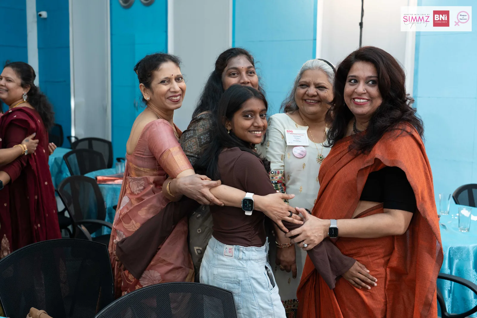Meera Grover greeting attendees at a leadership event