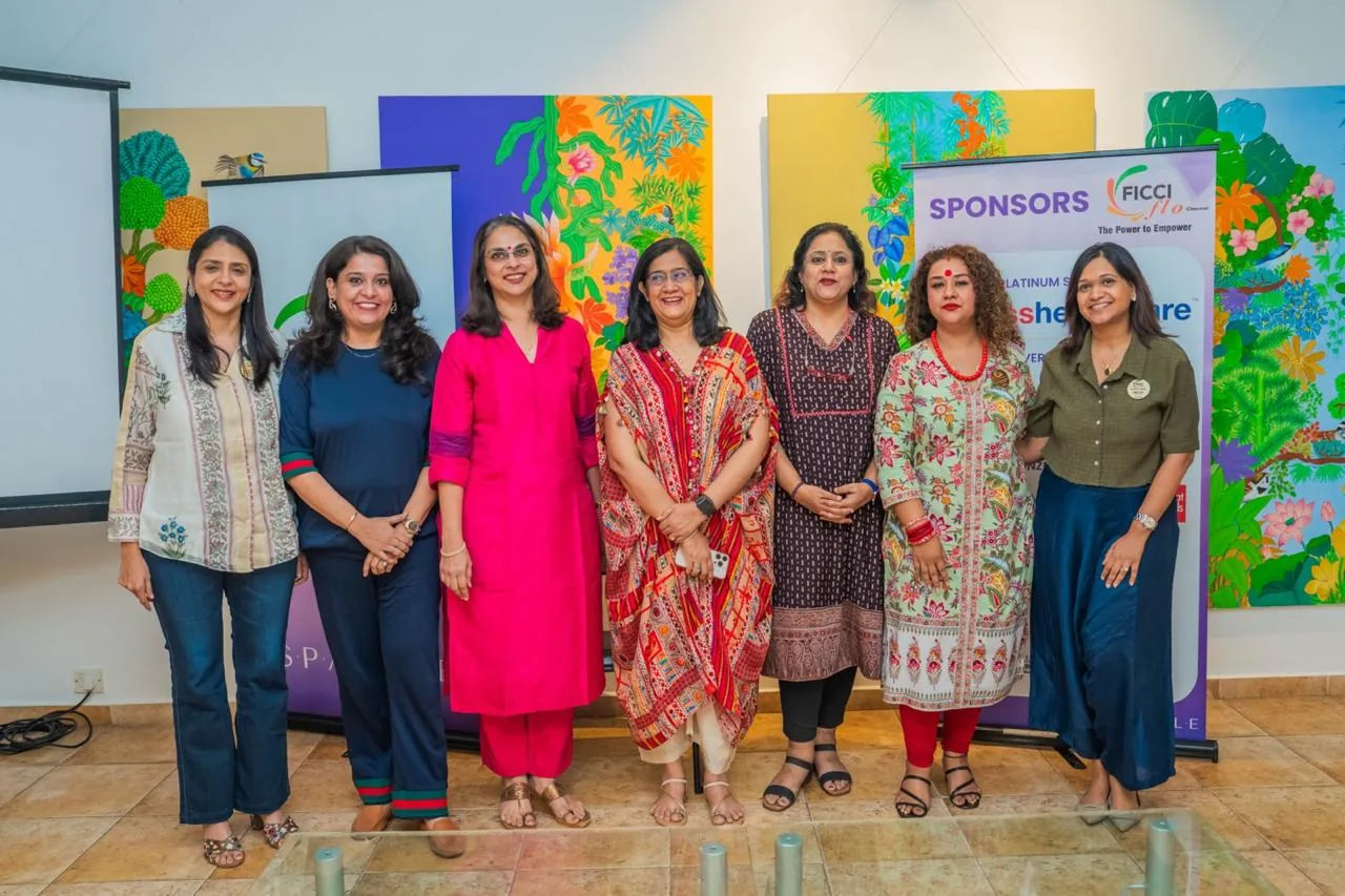 Meera Grover with a panel of women leaders at an event