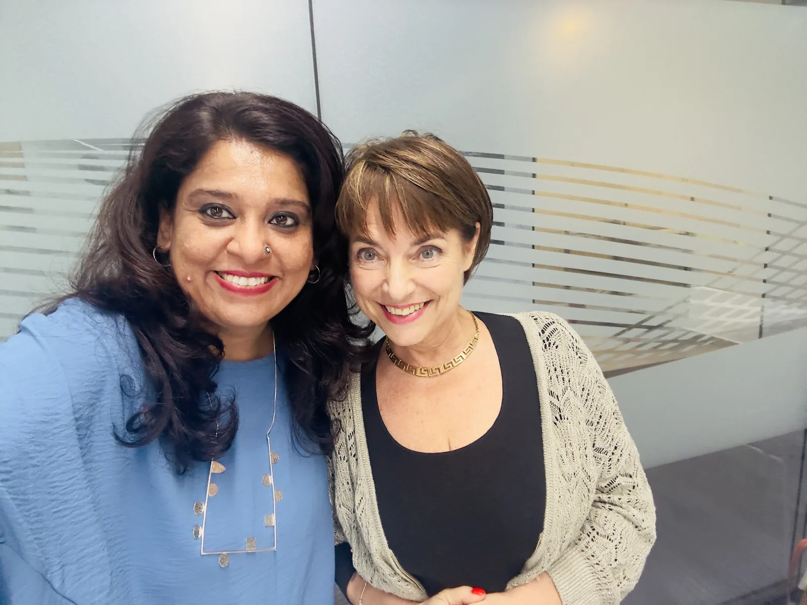 Meera Grover with a guest at a speaking event